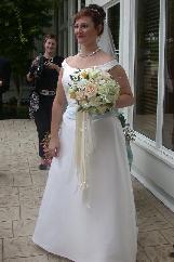 roses of all kinds, white freesia, stock, stephanodis, sweetpeas in a clutch style bridal bouquet that her wedding coordinator/florist created