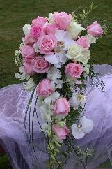 wedding bouquet, bridal bouquet, cascade bouquet, roses orchids phalenopsis orchids, dendrobium orchids, flower expertwedding florist, florist