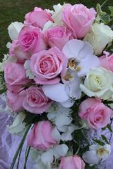 wedding bouquet, pink roses, white dendrobium orchids, white stephanodis, white phalenopsis orchids. wedding florist wedding planner, florist