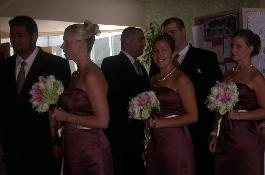 Stargazer lilies, roses, hydrangia, freezia, viburnium bridesmaid clutch bouquets.  Great floral flowers.