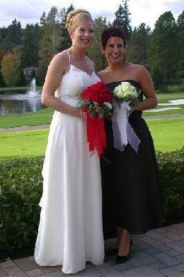 kardinal red roses in nosegay bridal bouquet and maid of honor round bouquet with roses and freesia designed by the wedding coordinator.