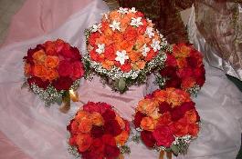 brides bouquet and 4 orange, red and black magic roses for bridesmaids bouquets