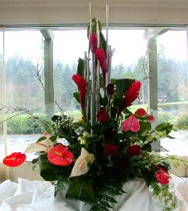 huge room decoration of exotic flowers.  ginger, antheriums, roses, orchids and exotic greens